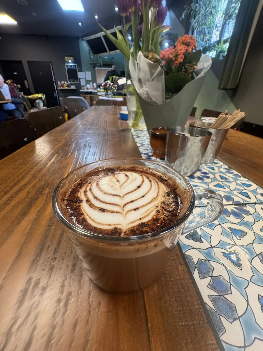 Latte art poured by a volunteer barista at Revive Cafe Norwich